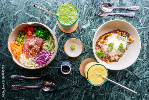 Gastronomic composition with poke bowl, pasta and green drinks