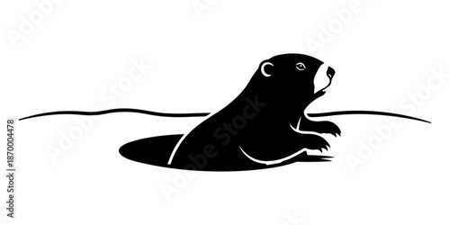 Silhouette of a groundhog emerging from its burrow