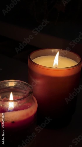 Candles burning brightly Candles illuminate the interior of church, creating a serene atmosphere with warm flickering light that reflects the spiritual ambiance and relaxation. High quality 4k footage