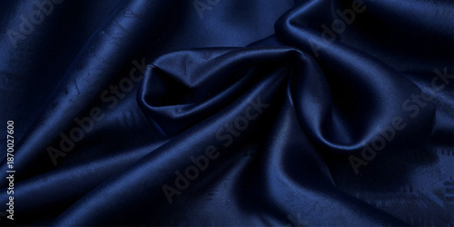Dark Blue Satin Silk Fabric Texture Background with Graceful Flowing Waves and Draped Folds, Creating an Elegant Abstract Luxury Wallpaper for Fashion and Design