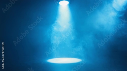 Dramatic blue spotlight shining through smoke in dark room - 4k video