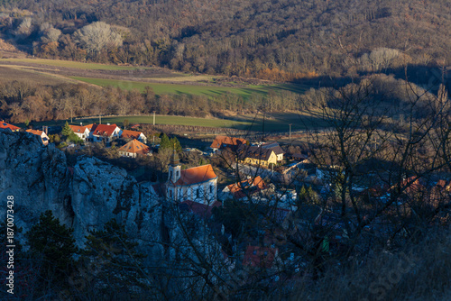 Close-up of Klentnice village with St. George Church at the foot of Palava rocks. Winter afternoon in a scenic South Moravian landscape