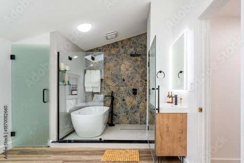 Fotografija Modern spa bathroom interior with freestanding soaking tub, glass shower enclosu