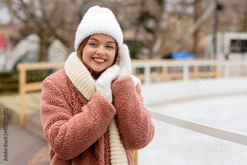 Young woman near ice rink i...