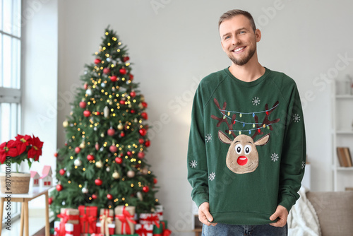 Young man in Christmas swea...