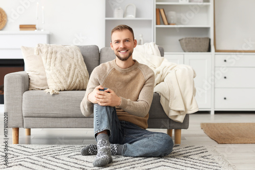 Young man in beige sweater ...