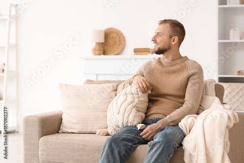 Young man in beige sweater ...
