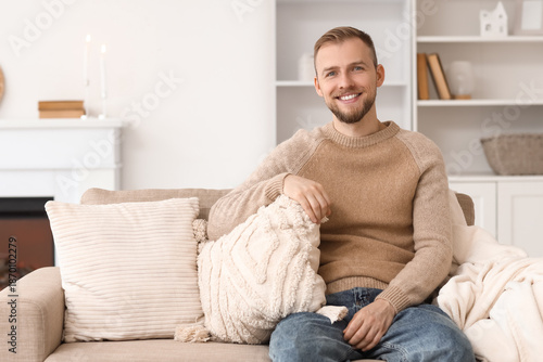 Young man in beige sweater ...