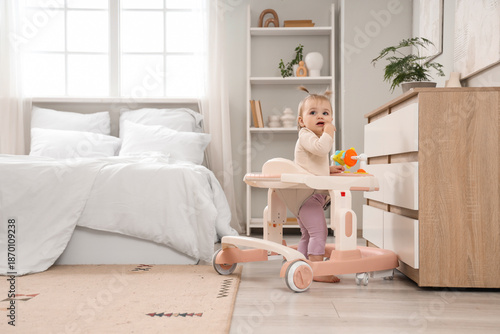 Cute little baby girl using...