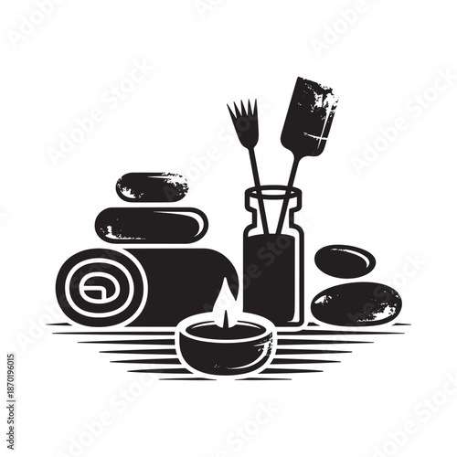 Zen spa arrangement with stones candle and massage tools in black and white