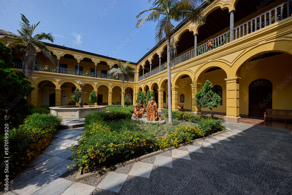 Obraz premium Silence and sunlight in the heart of Lima. The Convento de Santo Domingo offers a peaceful escape from the bustling city streets, where centuries of history are preserved in every carved wooden 
