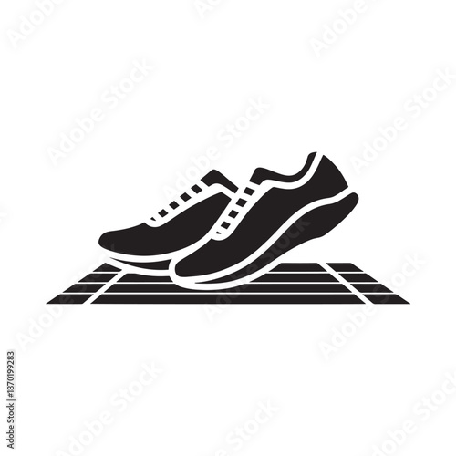 Running shoes on a track an icon representing athleticism and speed