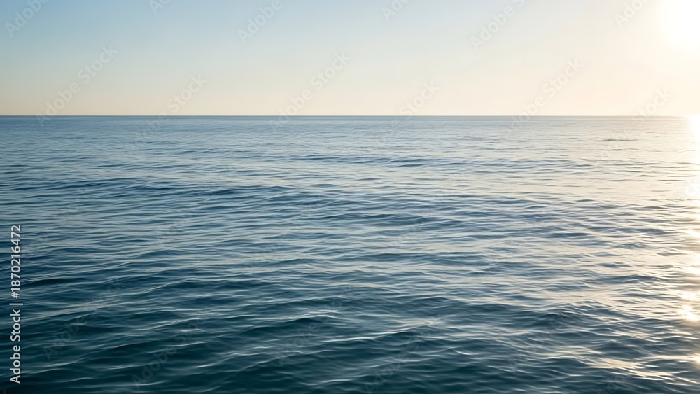 Fototapeta premium Vast Ocean Horizon with Gentle Ripples Reflecting the Sunlight