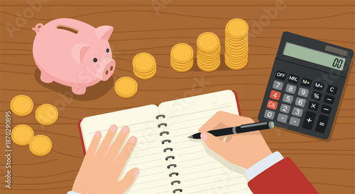 Personal Finance and Saving A Top-Down View of Hands Writing in a Notebook with Piggy Bank, Coins, and Calculator on a Wooden Desk