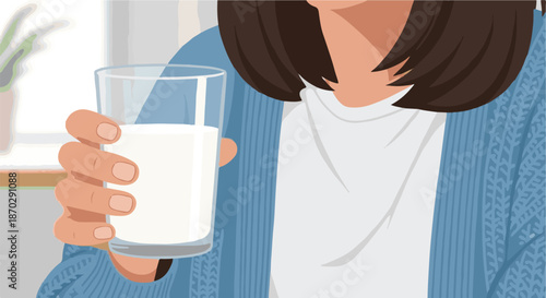 Close-up of a person holding a fresh glass of milk, a healthy and refreshing dairy drink for a balanced lifestyle, promoting daily wellness