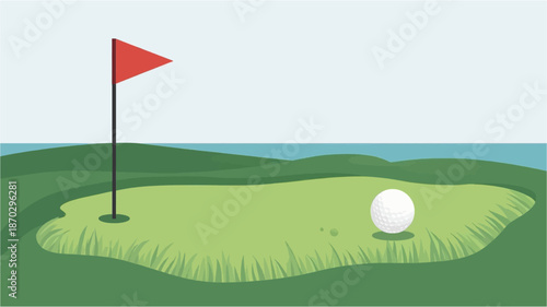 A golf ball rests on a green putting surface next to a red flag, with the ocean in the background under a clear sky.