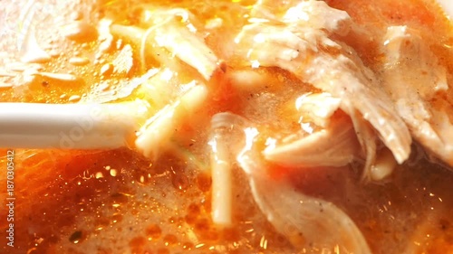 Close-up of spoon pick chicken soup