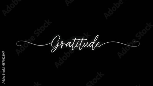 Gratitude written in elegant white cursive on black background