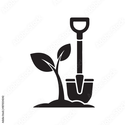 Garden shovel planting a young plant with green leaves symbolizing growth and gardening