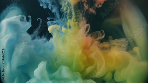 Rainbow colorful ink in water explosion.