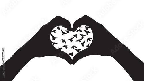 Love and Freedom: Silhouette hands form a heart, framing a flock of birds taking flight, symbolizing love and freedom.