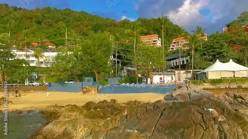 Kalim Beach tropical panorama view rocks sea palms Phuket Thailand.