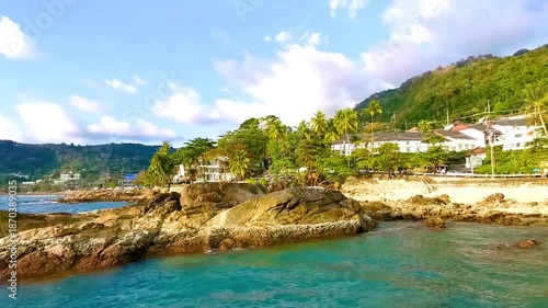 Kalim Beach tropical panorama view rocks sea palms Phuket Thailand.