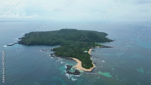 Aerial view from ilheu das Rolas,a islet in the archipelago of São Tomé, located in the Gulf of Guinea, south of the island.A volcanic origin, it lies directly on the Equator Line.Drone shot circular.