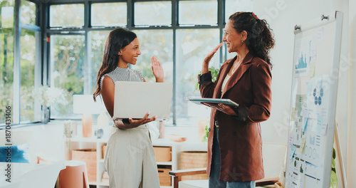 Tableau sur toile Creative women, high five and tech for designer agency in office for internship or project management