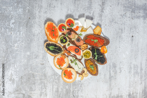 Assorted gourmet sandwiches with various toppings on a rustic plate