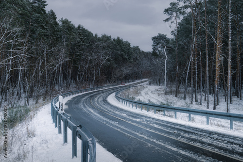 Wintery street with snow and slush - atmospheric winter landscape

