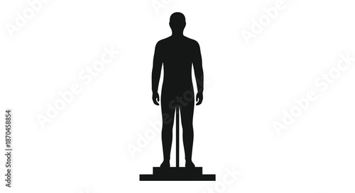 A stark black human figure stands prominently on a raised platform a striking silhouette