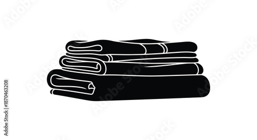 A stark black and white depiction of neatly folded towels presented as a striking silhouette