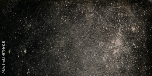 A vintage textured background featuring a mottled dark sepia tone with subtle scattered light highlights throughout