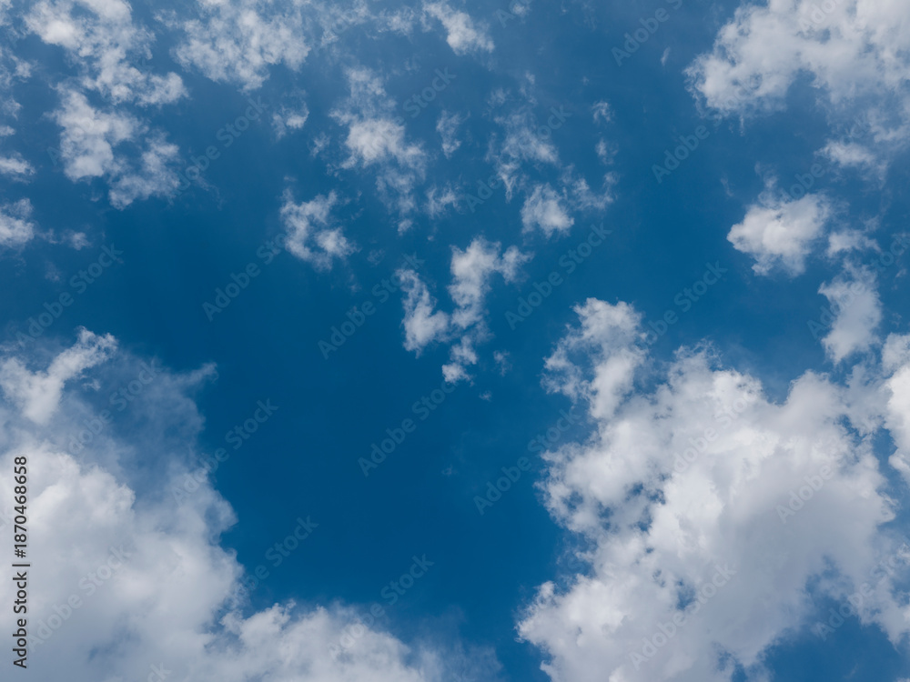 Obraz premium fluffy white clouds in a blue sky
