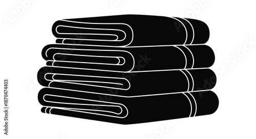 A neatly folded stack of dark towels presented against a bright white background silhouette