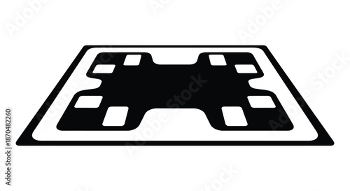 A striking black and white graphic depicting a gamepad controller design a bold silhouette