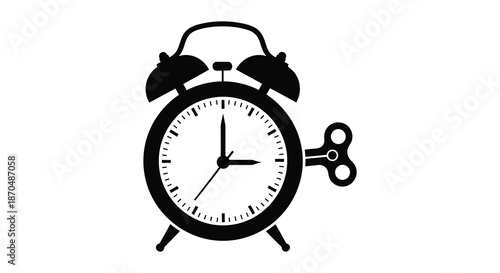 A striking black silhouette of a classic alarm clock with a winding key design silhouette