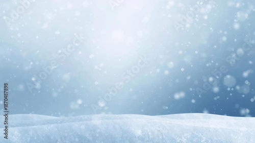 A serene winter scene with falling snow and a gentle snowdrift under a soft blue sky.