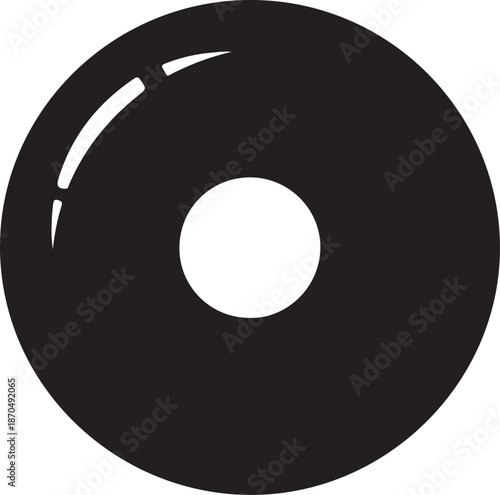 A black circular object with a central hole