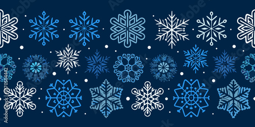 Seamless pattern of delicate white and blue snowflakes on a dark background