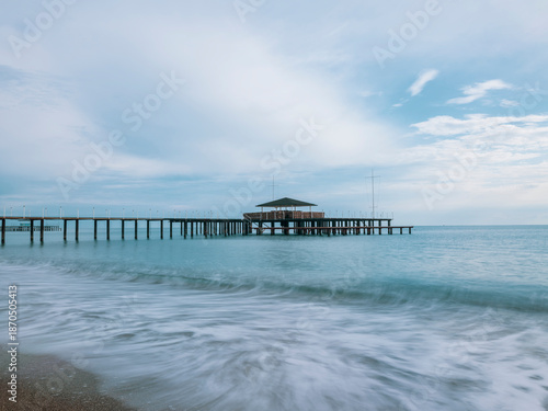 serene sunset scene with an old pier and calm sea