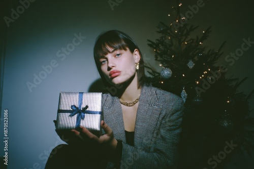 Wallpaper Mural An Enigmatic Moment: A Chic Portrait of Anticipation Amidst Holiday Cheer and Gift-Giving Spirit Torontodigital.ca