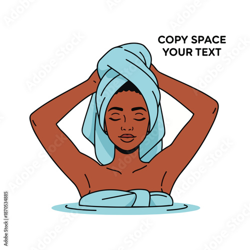 A woman wraps a towel around her head