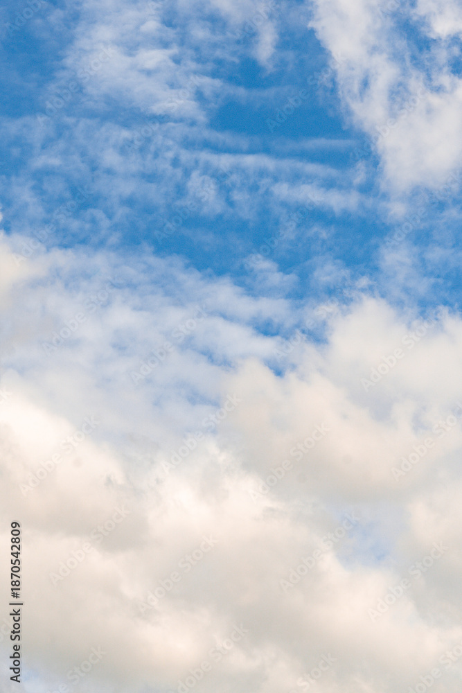 Fototapeta premium Blue Sky Background with Soft Clouds