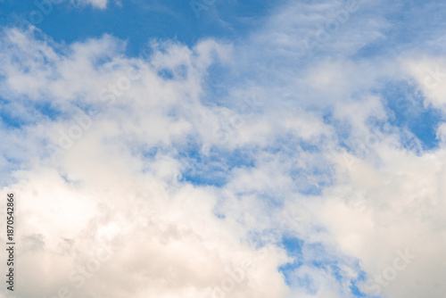Bright Blue Sky with Fluffy Clouds