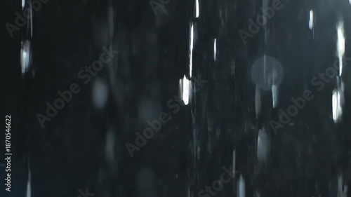 Night Rain Drops Falling in Dark Frame.
