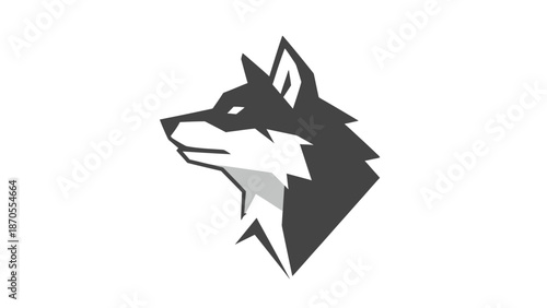 Elegant profile of a wolfs head, showcasing its focused gaze and sharp features.