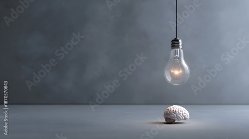Conceptual idea of inspi n light bulb above brain