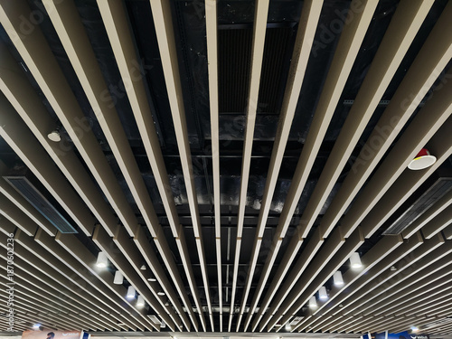 Canvas Print Kuala Lumpur, Malaysia - December 10, 2025 - Modern Ceiling Design with Parallel Beam Pattern and Integrated Lighting for Architectural Interior Texture installed at Kuala Lumpur Pasar Seni Station